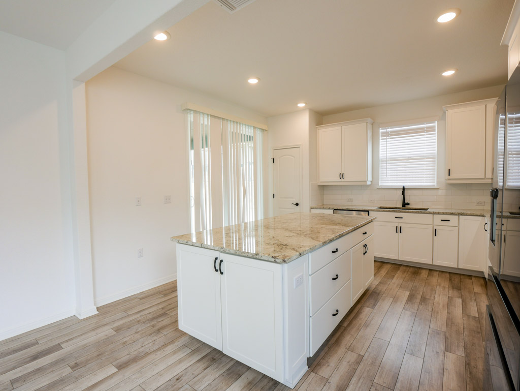 103 Kitty Hawk Road Georgetown, TX 78633 - Photo 13 of 34 a kitchen with sink cabinets and wooden floor