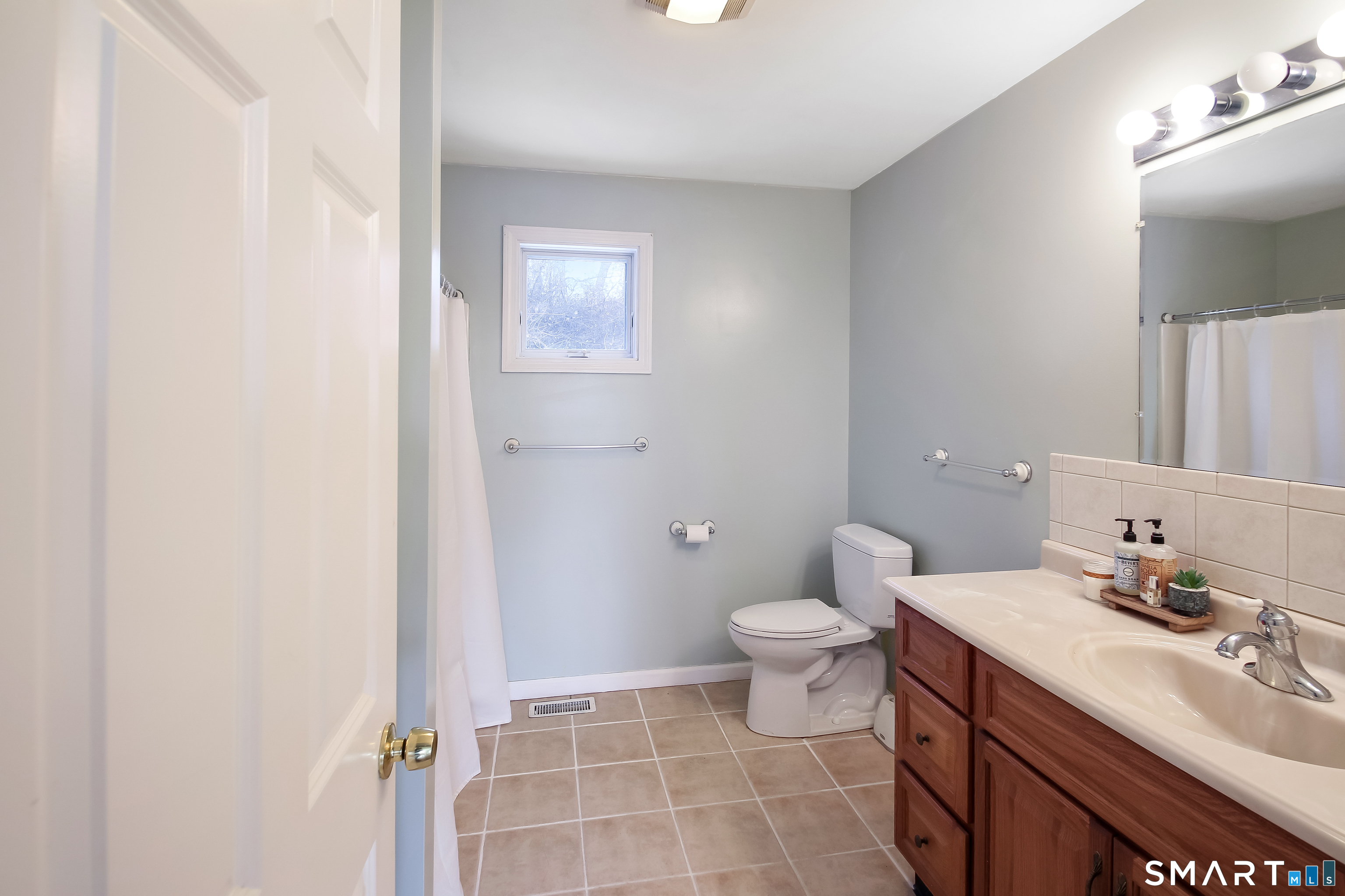 91 Insalaco Drive Windham, CT 06280 - Photo 18 of 20 a bathroom with a sink toilet and vanity