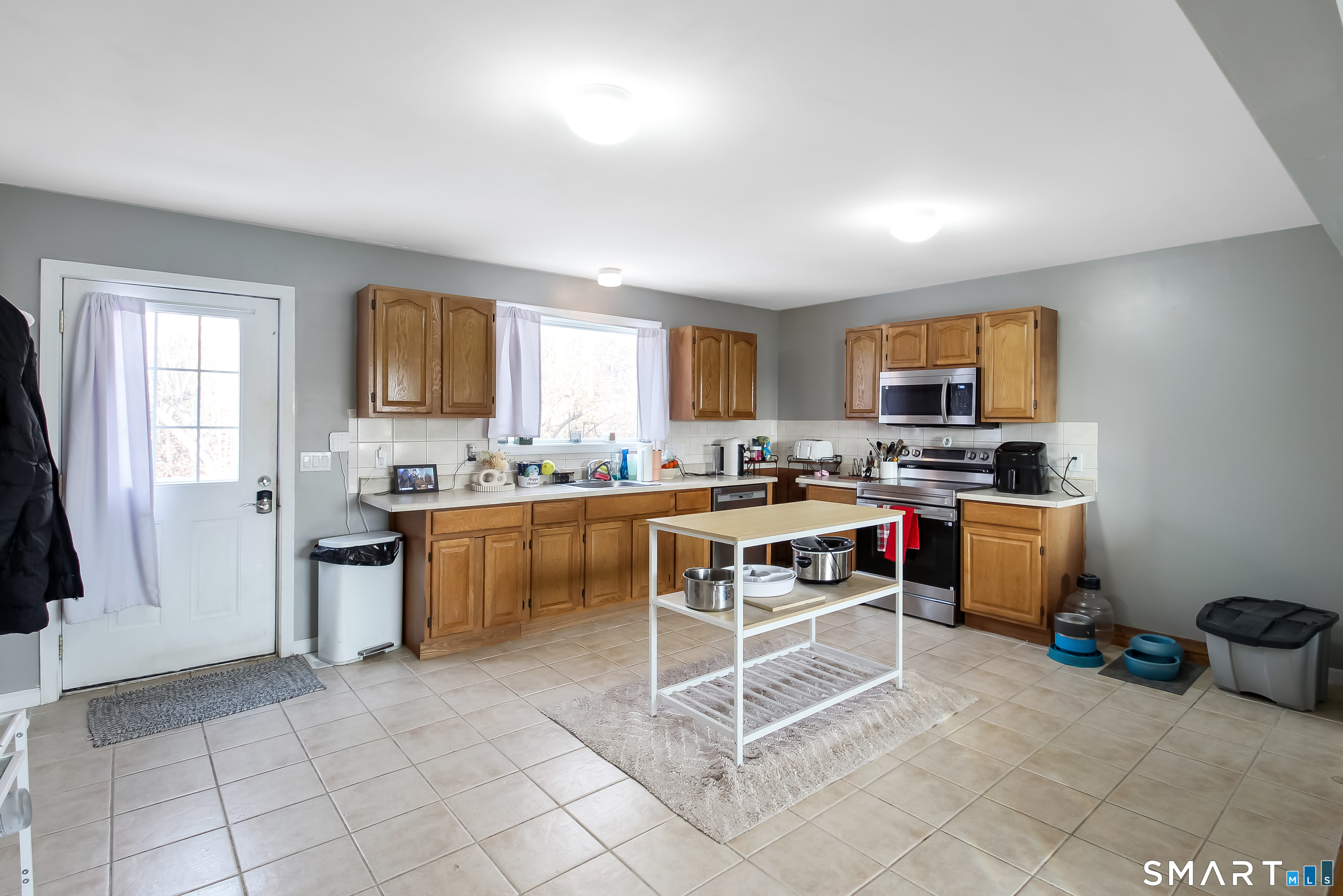 91 Insalaco Drive Windham, CT 06280 - Photo 4 of 20 a kitchen with a refrigerator and cabinets