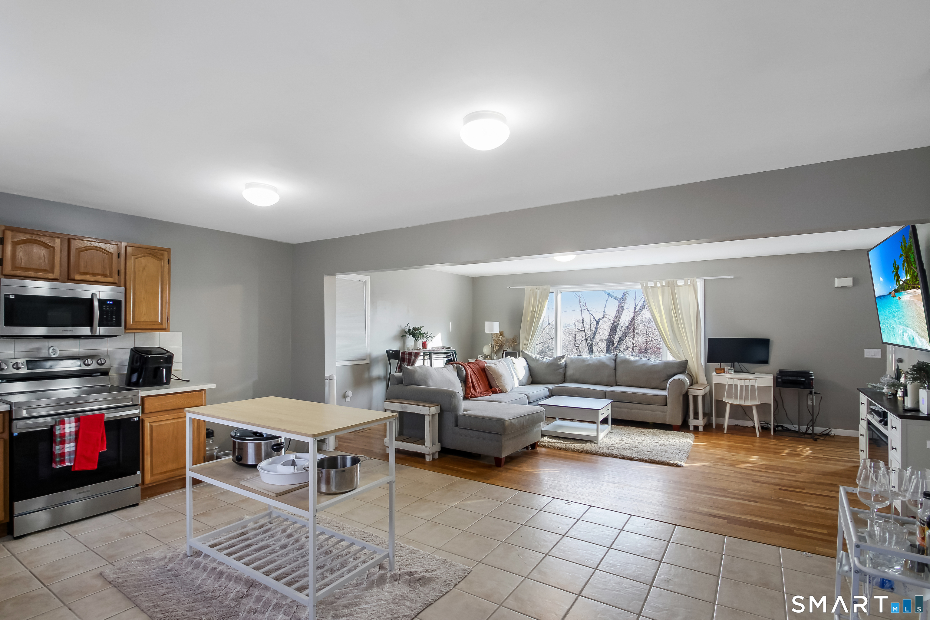 91 Insalaco Drive Windham, CT 06280 - Photo 9 of 20 a living room with furniture and a flat screen tv