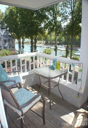 a view of a brick building with a table and chairs
