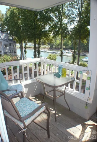 a view of a brick building with a table and chairs