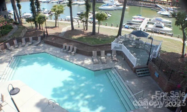 a view of a swimming pool with a patio
