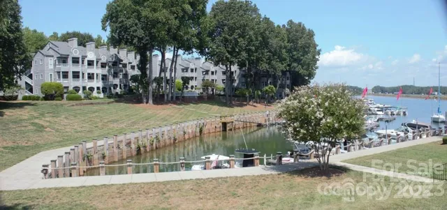 a view of a tall building with a yard