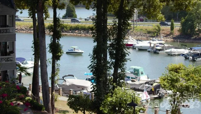 an aerial view of residential house with outdoor space and lake view