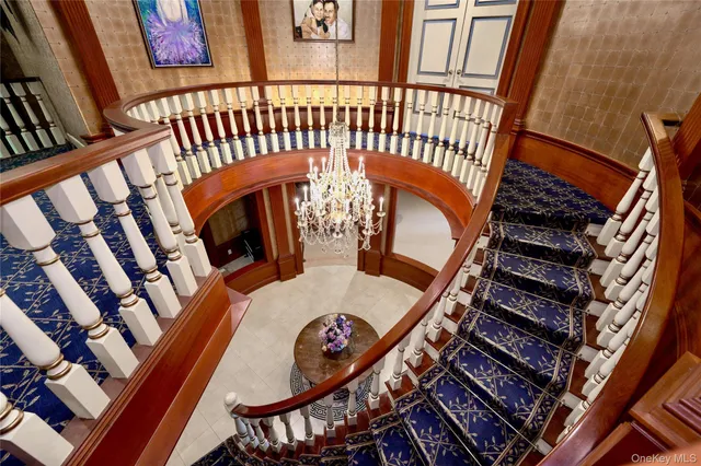 a bedroom with a bed and a mirror