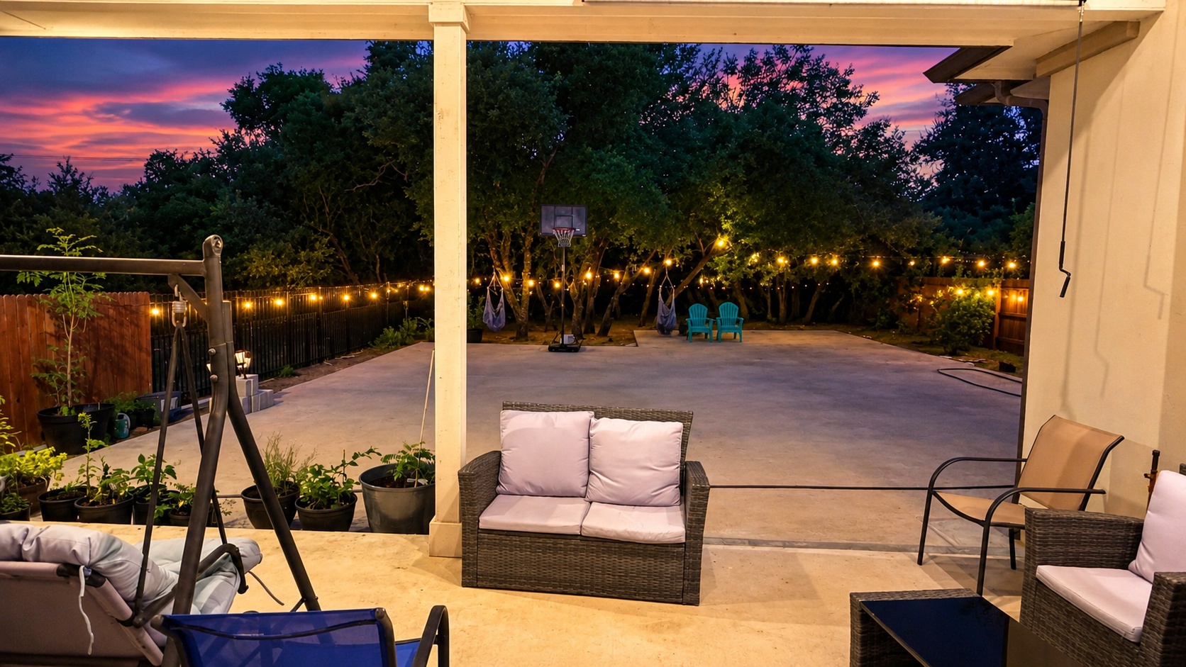 7290 Shoshoni Loop Round Rock, TX 78681 - Photo 4 of 6 An inviting covered patio opens to a string-lit yard, perfect for evening gatherings.