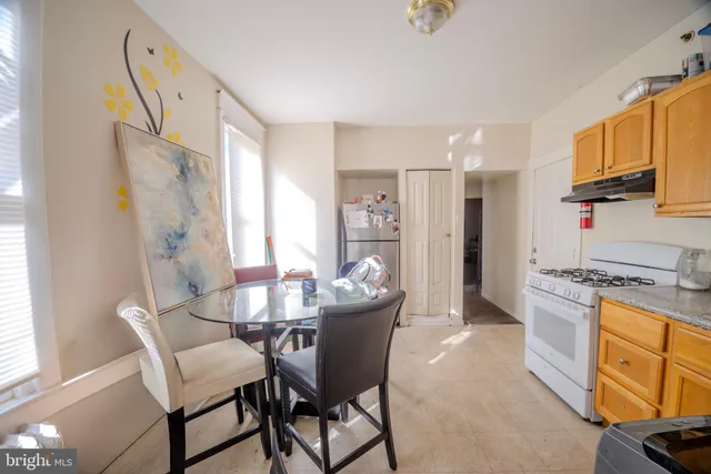 a dining room with furniture and window