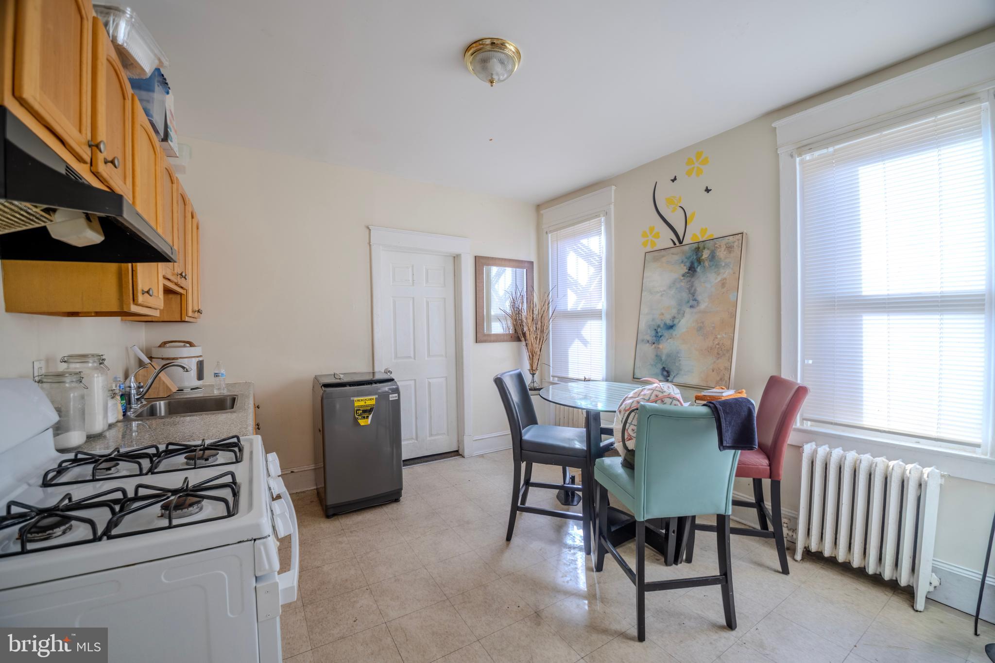 323 West 7th Street Chester, PA 19013 - Photo 19 of 39 a view of a dining room with furniture and a window
