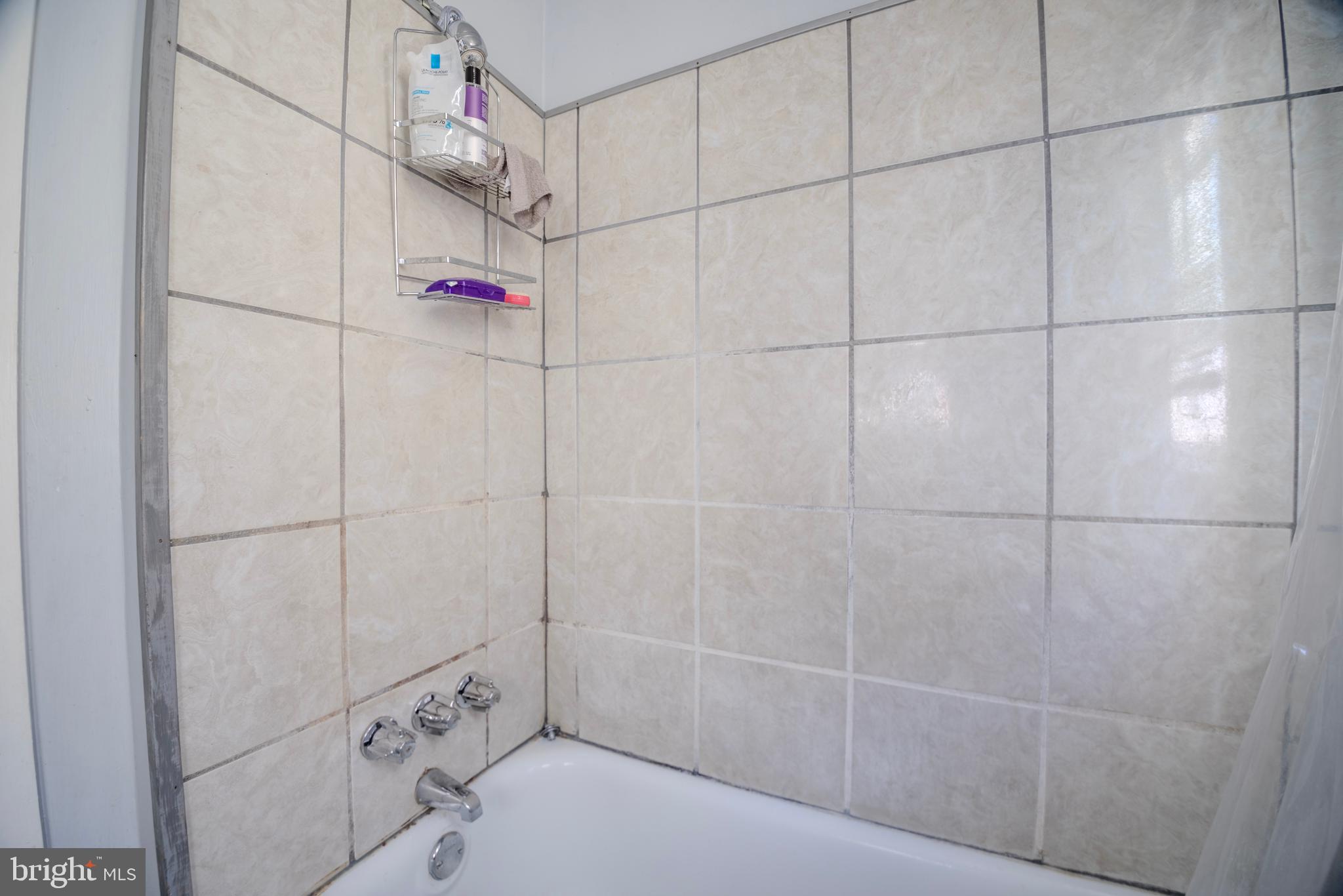 323 West 7th Street Chester, PA 19013 - Photo 20 of 39 a bathroom with a shower