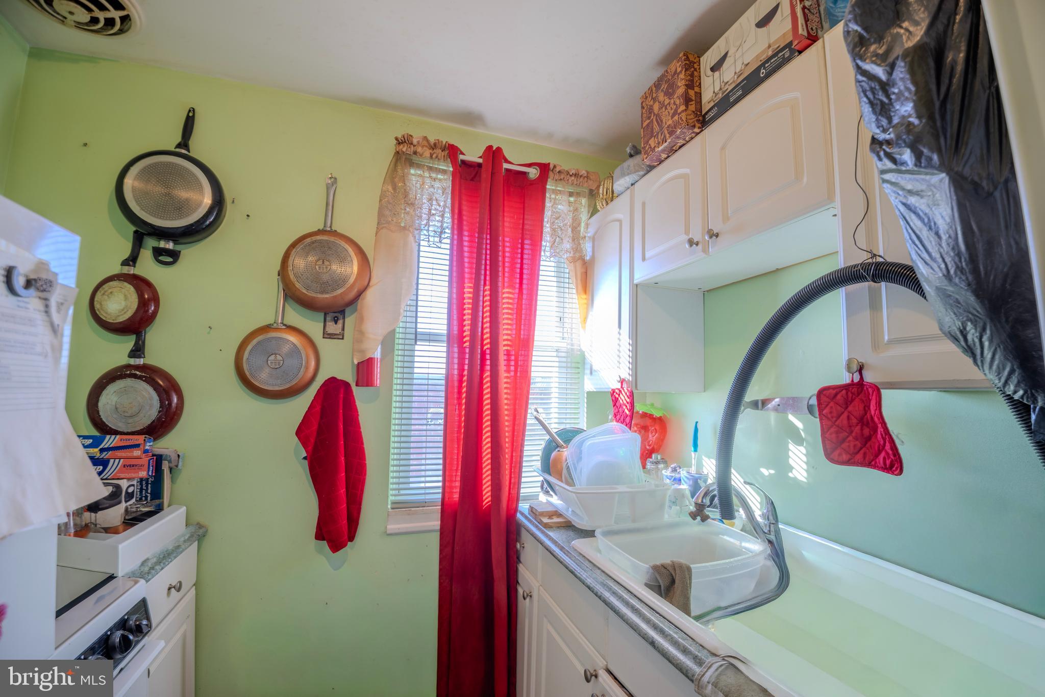 323 West 7th Street Chester, PA 19013 - Photo 23 of 39 a bathroom with a sink and a mirror