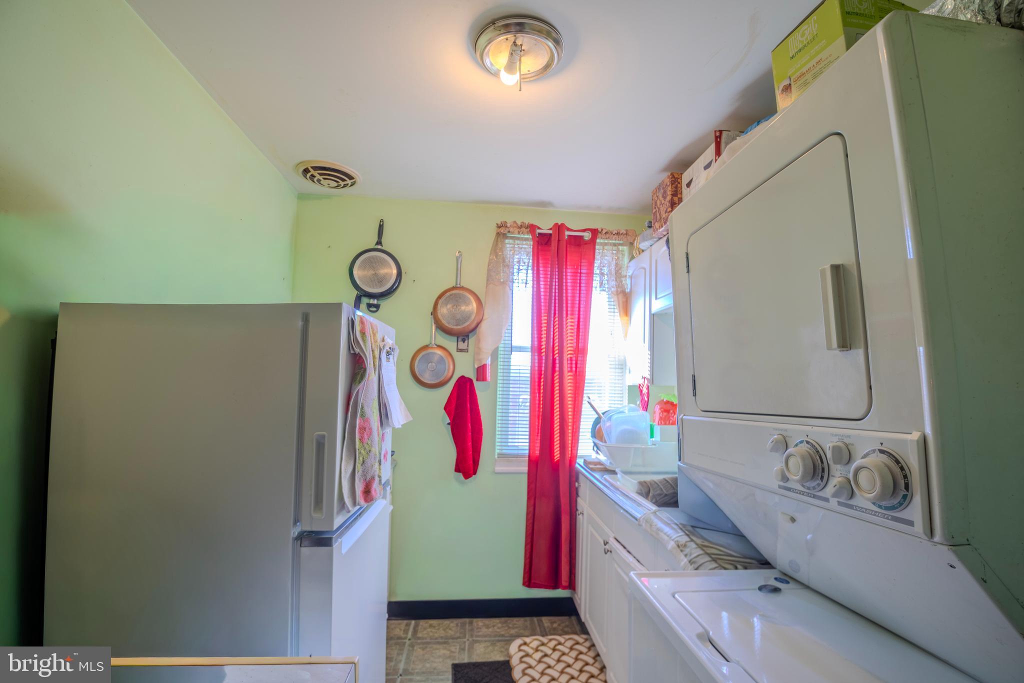323 West 7th Street Chester, PA 19013 - Photo 25 of 39 a bathroom with a sink and a refrigerator