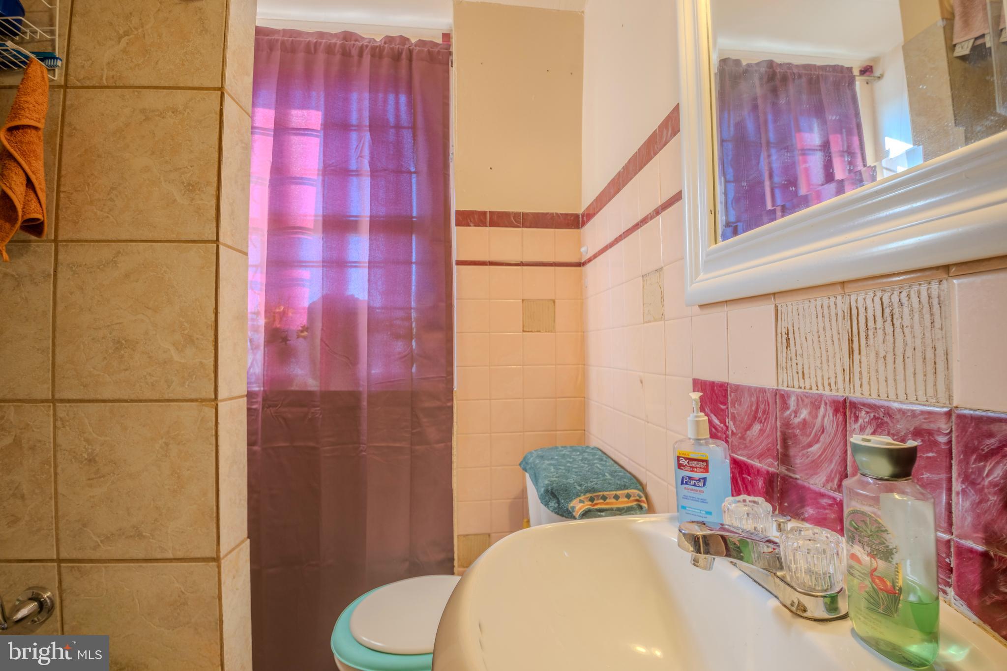 323 West 7th Street Chester, PA 19013 - Photo 27 of 39 a bathroom with a sink toilet and shower