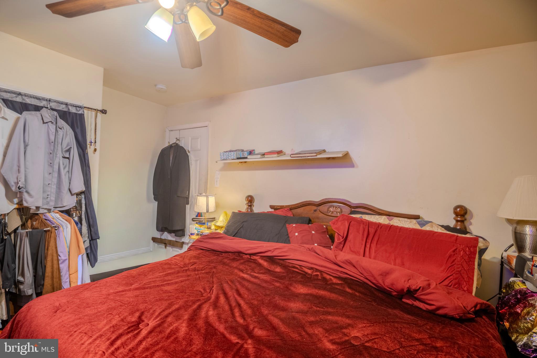 323 West 7th Street Chester, PA 19013 - Photo 29 of 39 a bedroom with a bed and a chandelier
