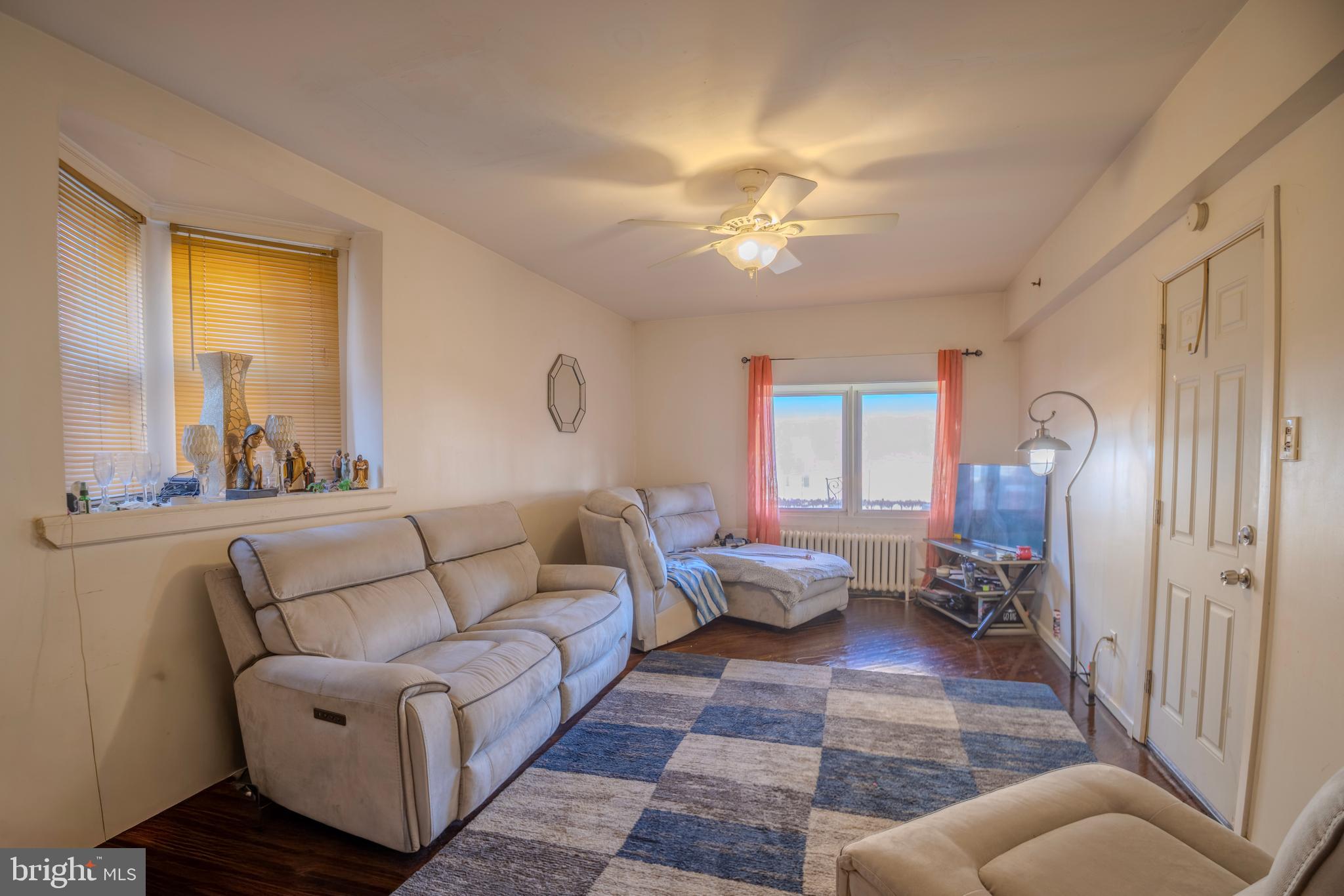 323 West 7th Street Chester, PA 19013 - Photo 5 of 39 a living room with furniture and wooden floor