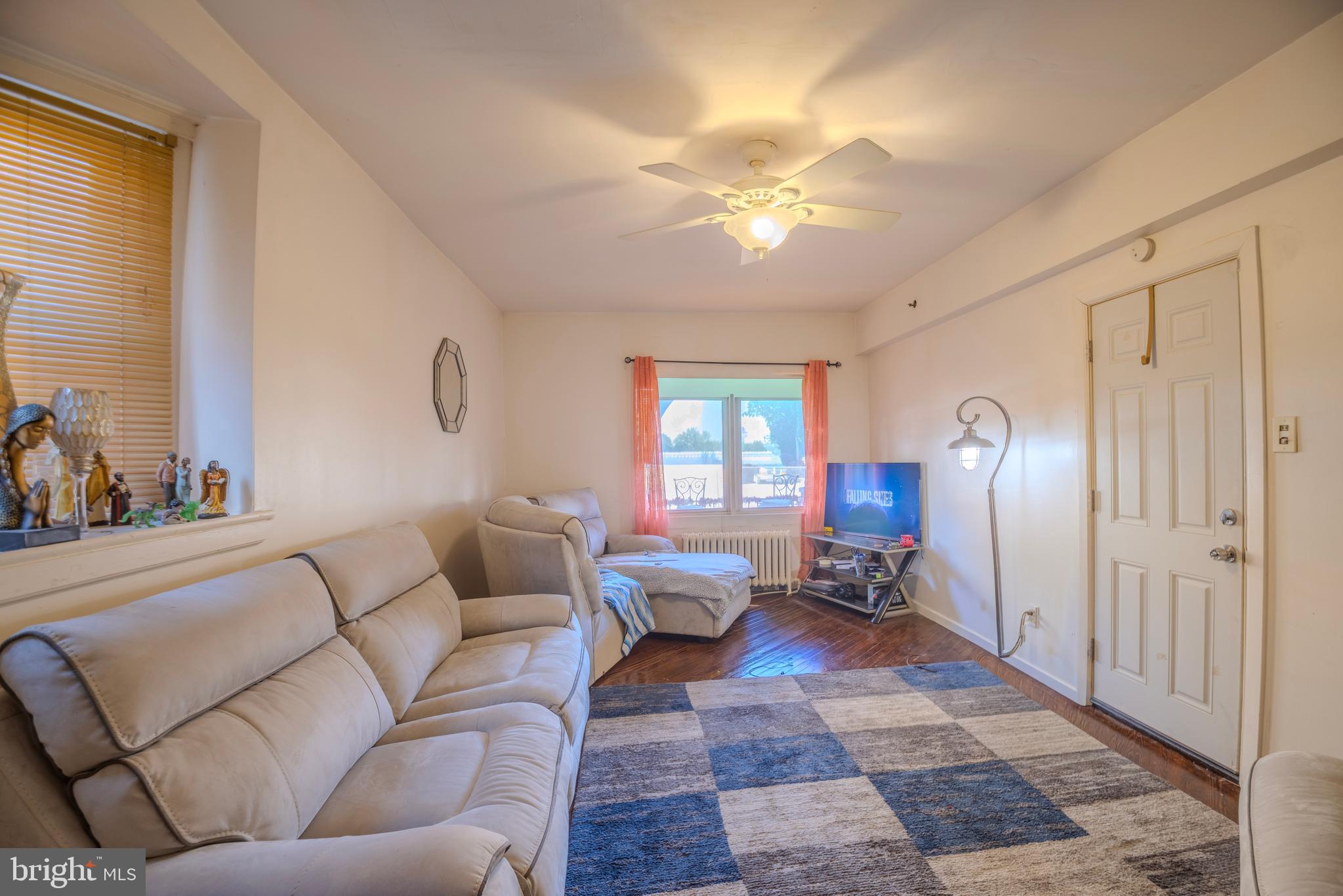 323 West 7th Street Chester, PA 19013 - Photo 6 of 39 a living room with furniture and a chandelier