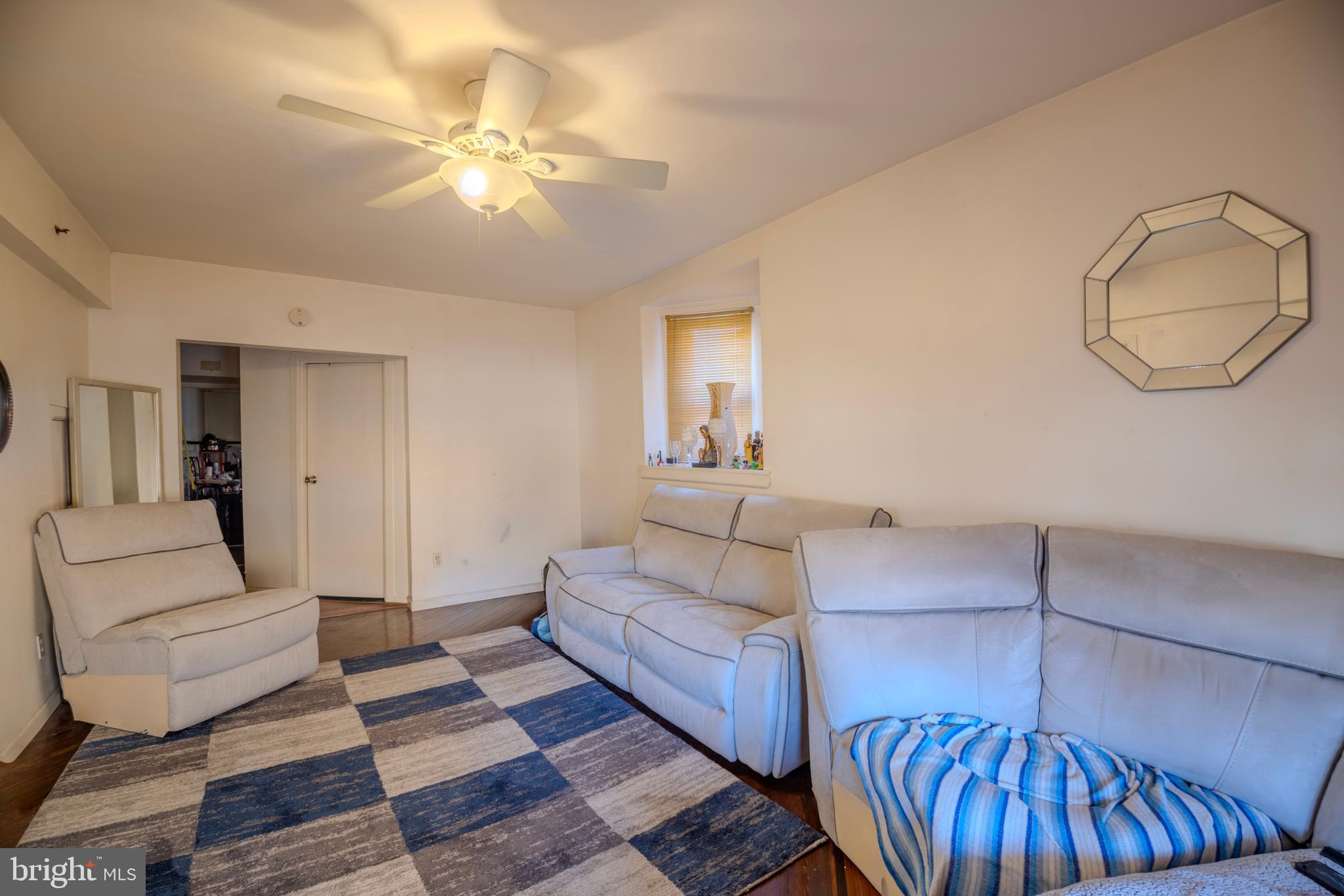 323 West 7th Street Chester, PA 19013 - Photo 7 of 39 a living room with furniture and a mirror