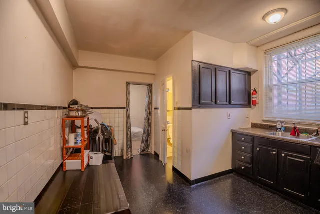 a view of a storage and utility room with lots of racks on the wall