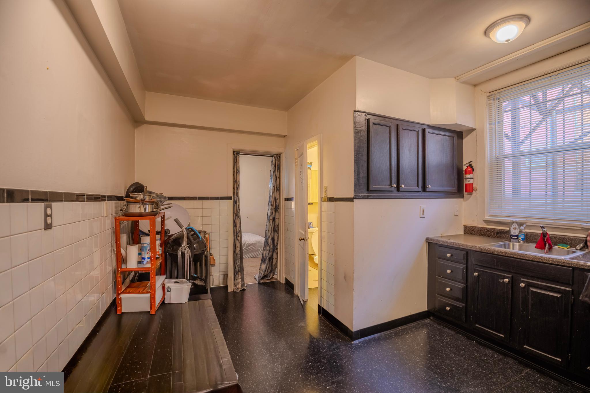 323 West 7th Street Chester, PA 19013 - Photo 10 of 39 a view of a storage and utility room with lots of racks on the wall