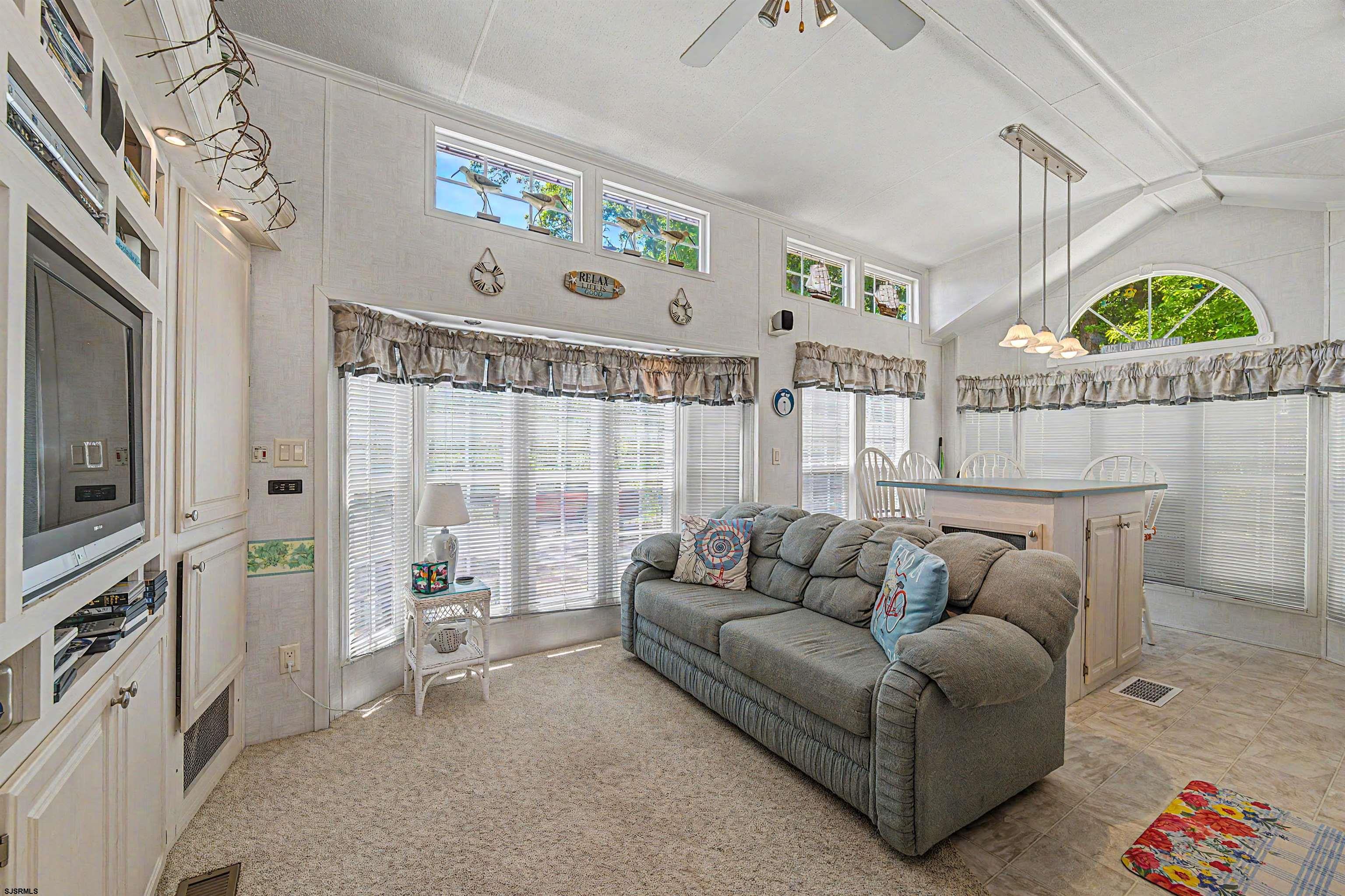 3066 Route 9 Ocean View, NJ 08230 - Photo 12 of 29 a living room with furniture and a flat screen tv