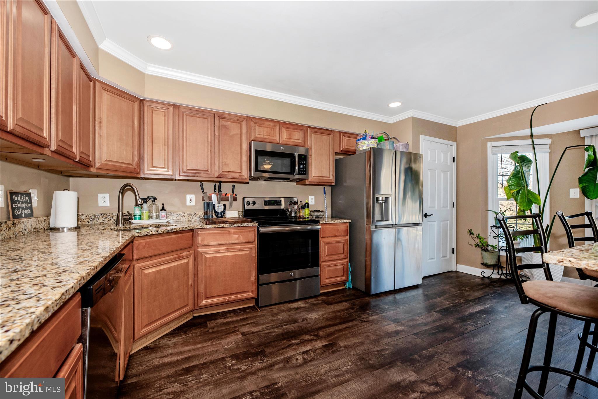 6630 Commodore Court New Market, MD 21774 - Photo 12 of 68 a kitchen with stainless steel appliances granite countertop a refrigerator stove and sink