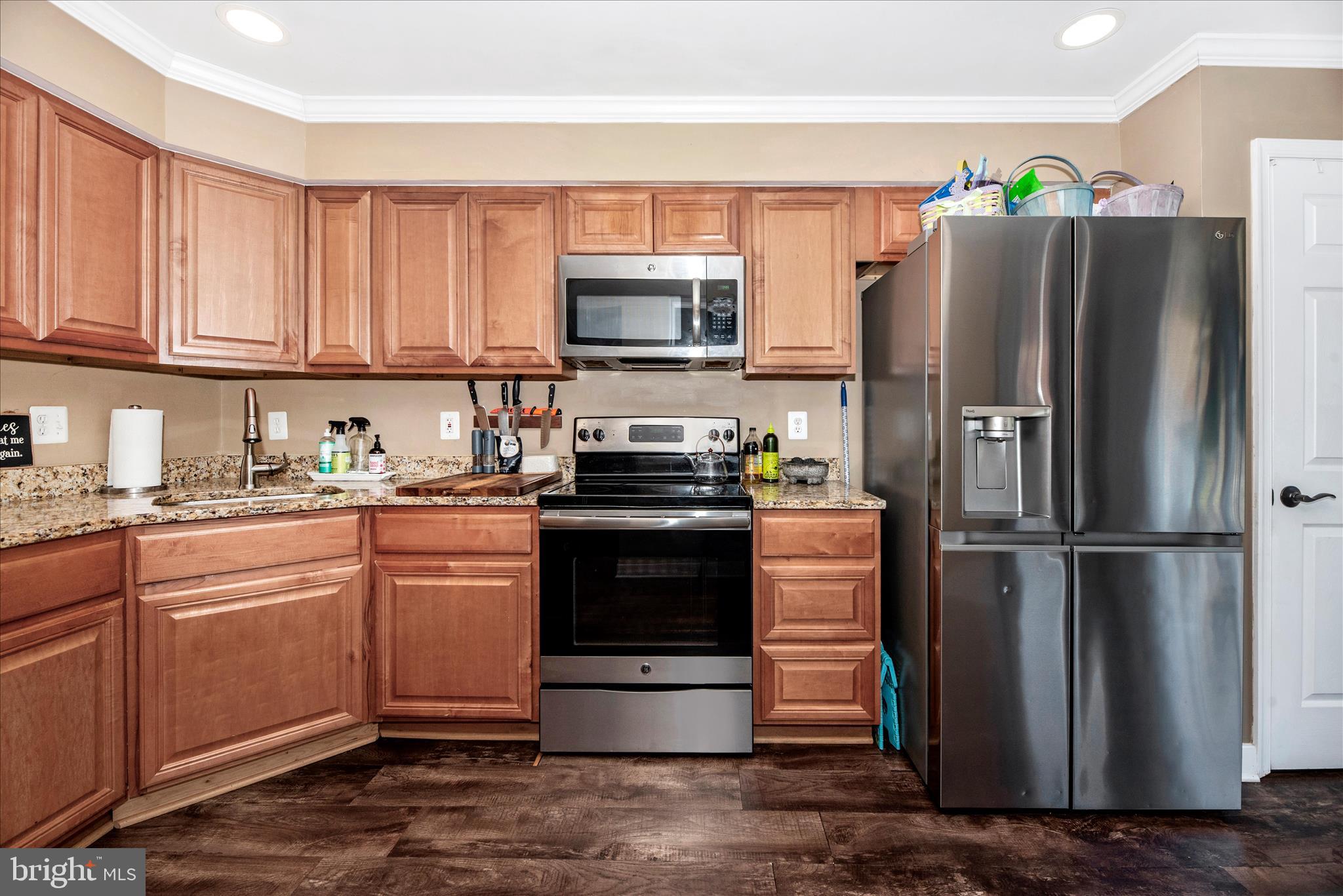 6630 Commodore Court New Market, MD 21774 - Photo 13 of 68 a kitchen with a refrigerator stove and microwave