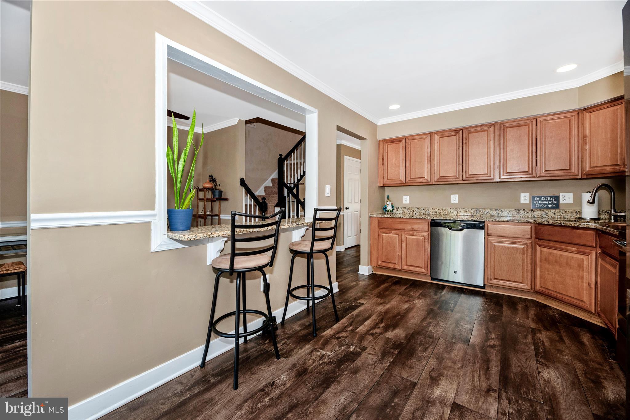6630 Commodore Court New Market, MD 21774 - Photo 15 of 68 a kitchen with granite countertop a stove a sink and a refrigerator