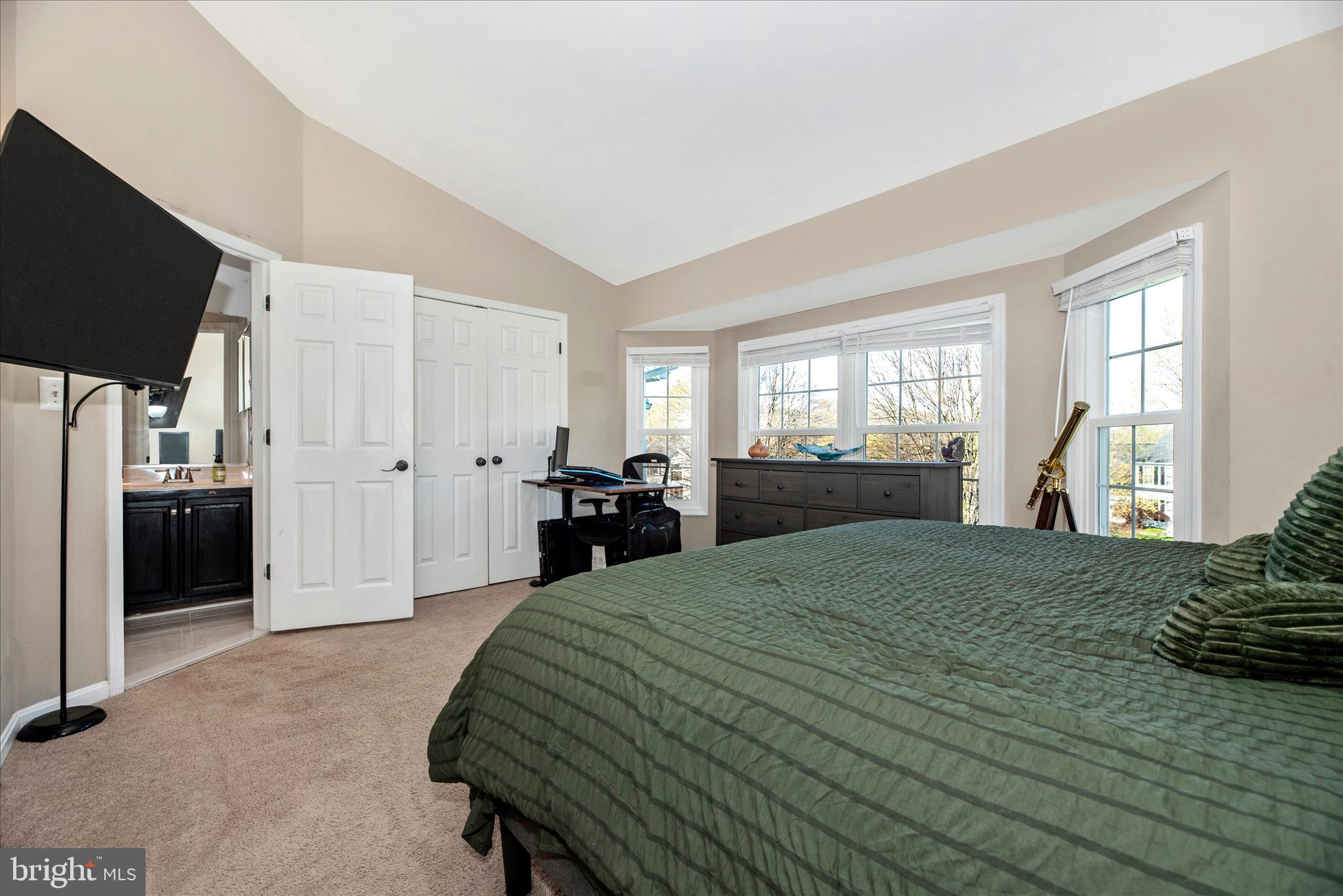 6630 Commodore Court New Market, MD 21774 - Photo 19 of 68 a large bed sitting in a spacious bedroom next to a window and dresser