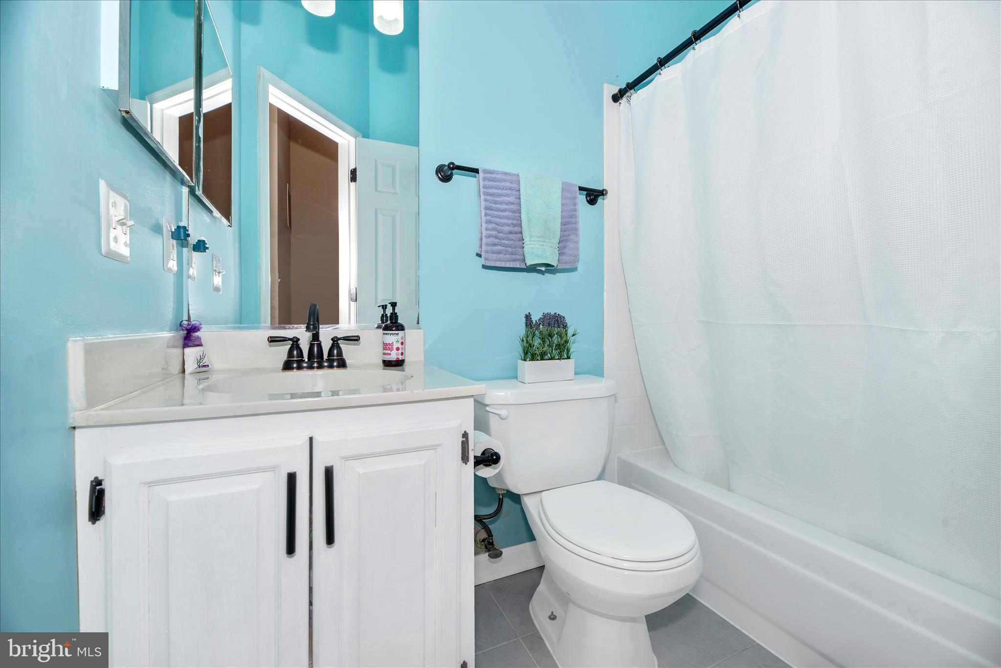 6630 Commodore Court New Market, MD 21774 - Photo 28 of 68 a bathroom with a sink a toilet and shower