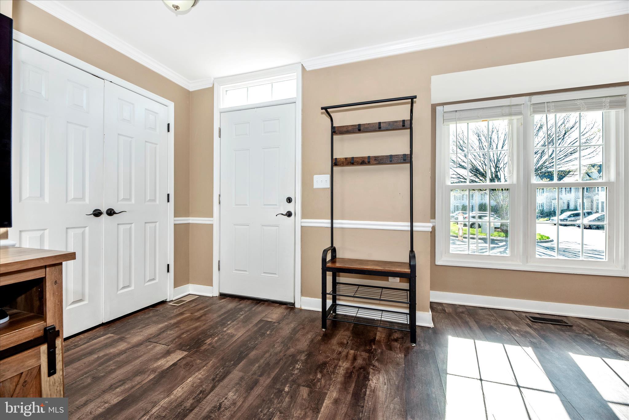 6630 Commodore Court New Market, MD 21774 - Photo 3 of 68 a view of empty room with wooden floor and fan
