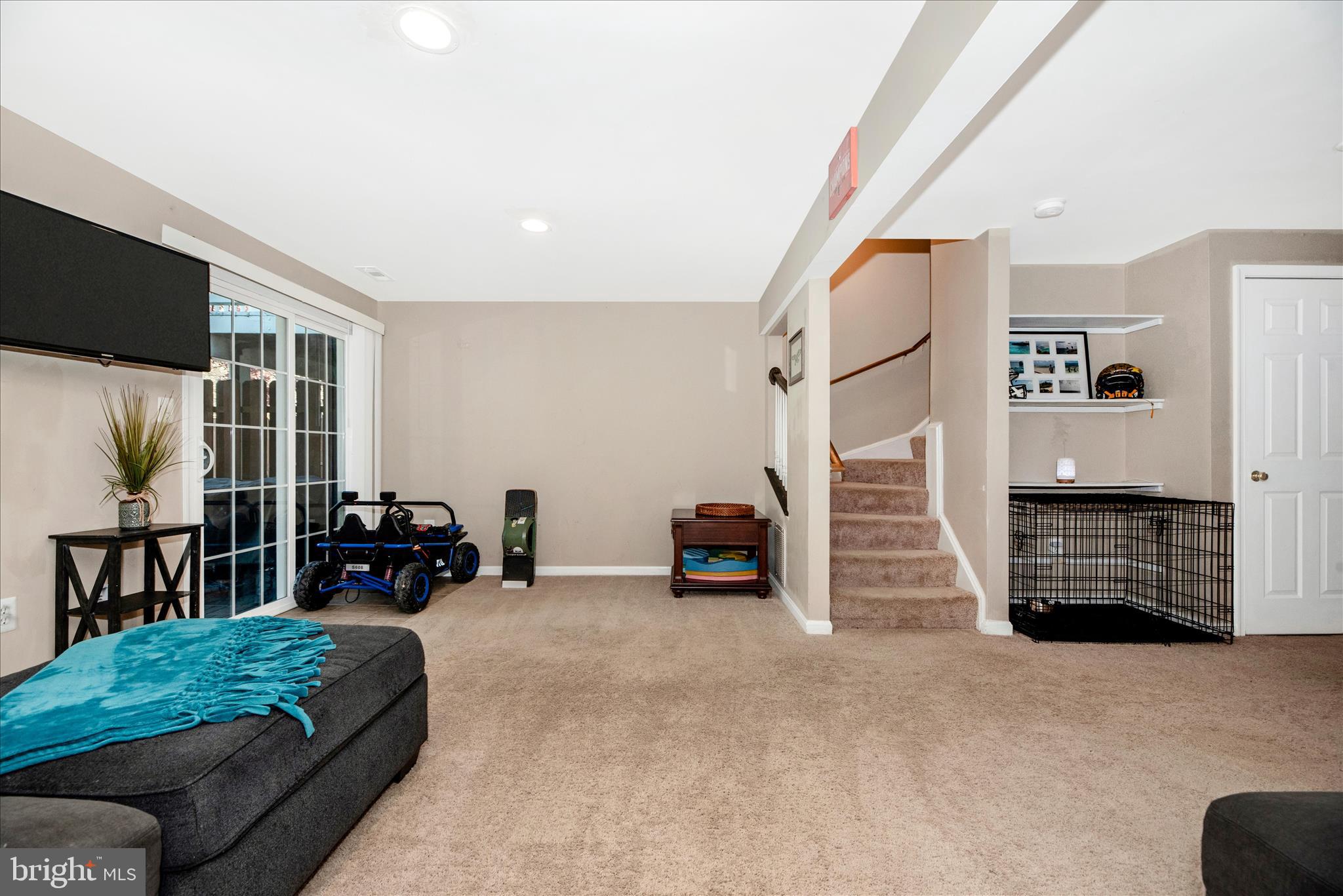 6630 Commodore Court New Market, MD 21774 - Photo 31 of 68 a living room with furniture and a flat screen tv