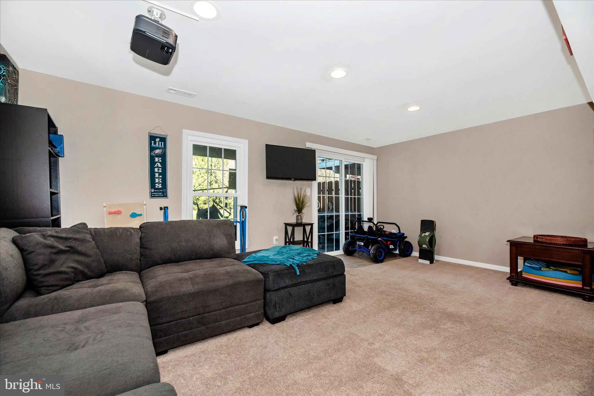 6630 Commodore Court New Market, MD 21774 - Photo 32 of 68 a living room with furniture and a flat screen tv