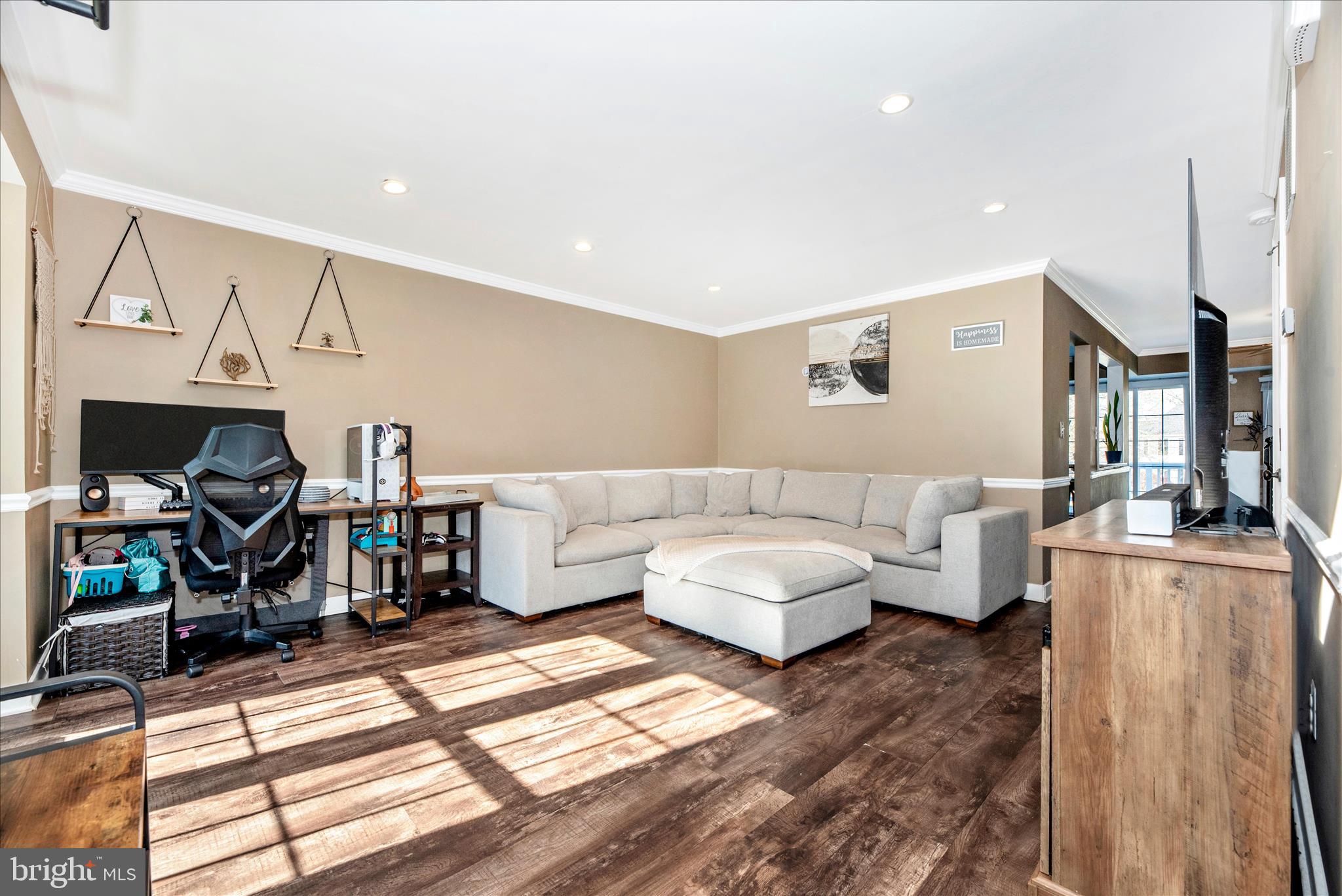 6630 Commodore Court New Market, MD 21774 - Photo 5 of 68 a living room with furniture a fireplace and a flat screen tv