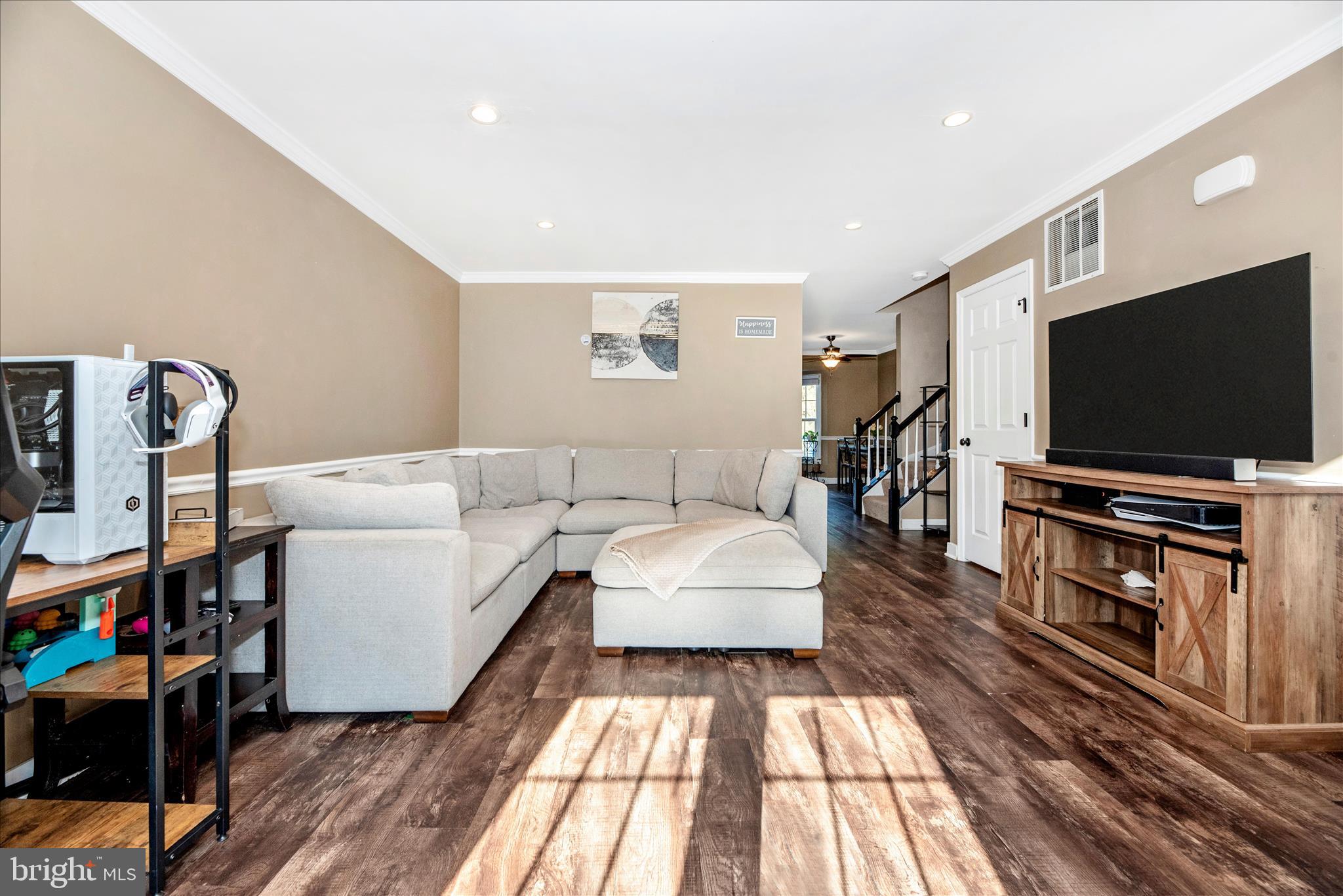 6630 Commodore Court New Market, MD 21774 - Photo 6 of 68 a living room with furniture and a flat screen tv