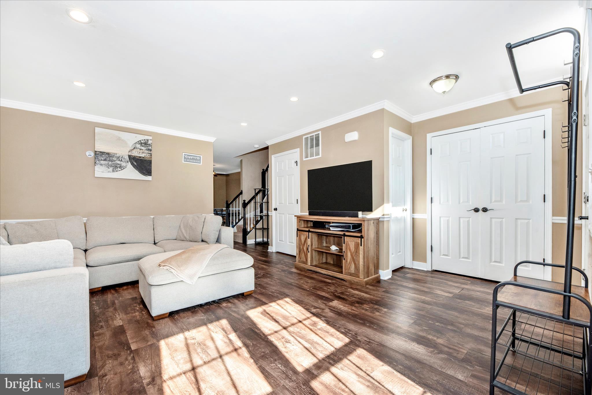 6630 Commodore Court New Market, MD 21774 - Photo 7 of 68 a living room with furniture and a flat screen tv