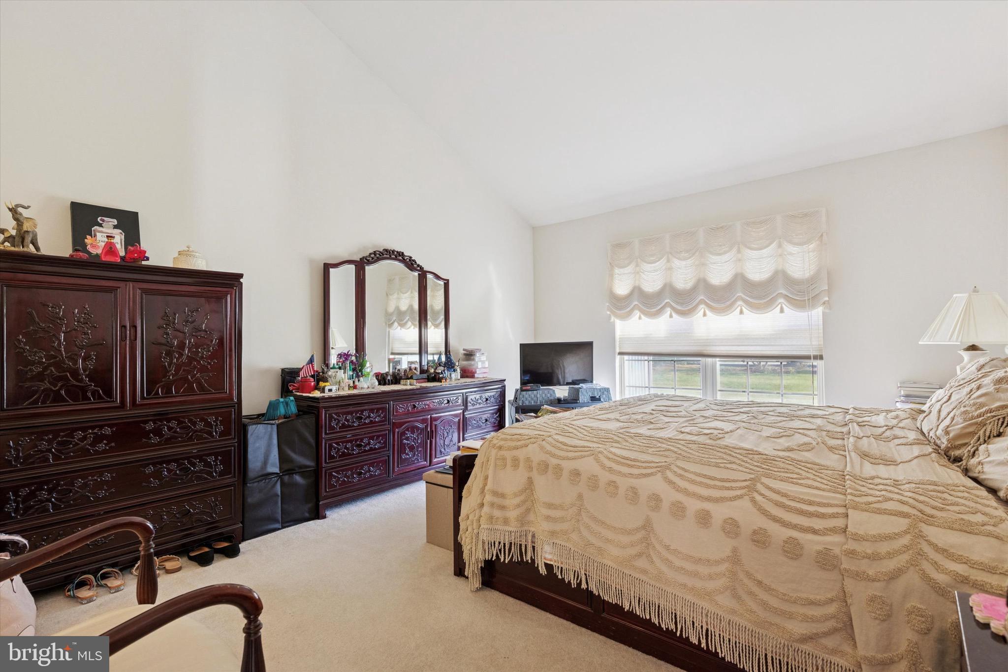 3821 Nanlyn Farm Circle Doylestown, PA 18902 - Photo 11 of 24 a bedroom with a bed dresser and a window
