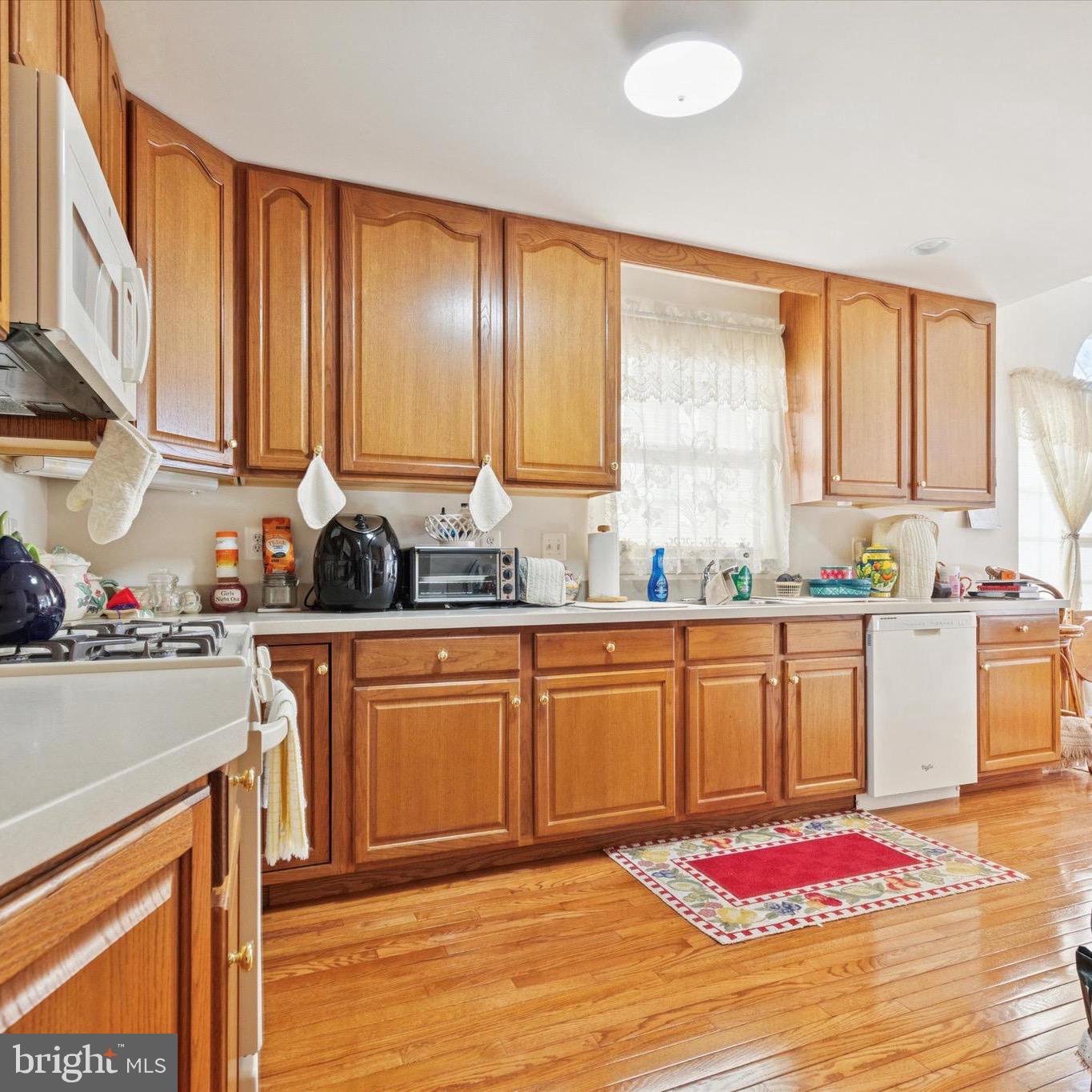 3821 Nanlyn Farm Circle Doylestown, PA 18902 - Photo 19 of 24 a kitchen with stainless steel appliances granite countertop a stove sink and cabinets
