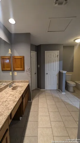a kitchen with stainless steel appliances granite countertop a sink and a stove