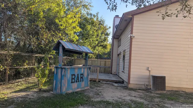 a house view with a backyard space