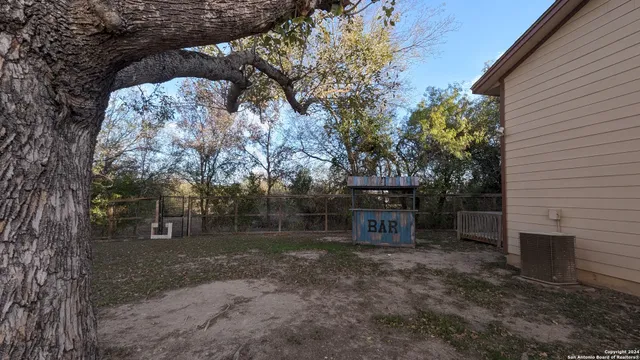 a backyard of a house with lots of green space