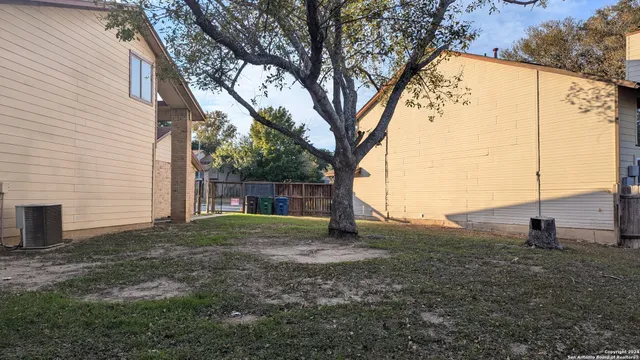 a view of a backyard of the house