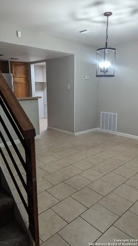 a view of water heater room with a ceiling fan