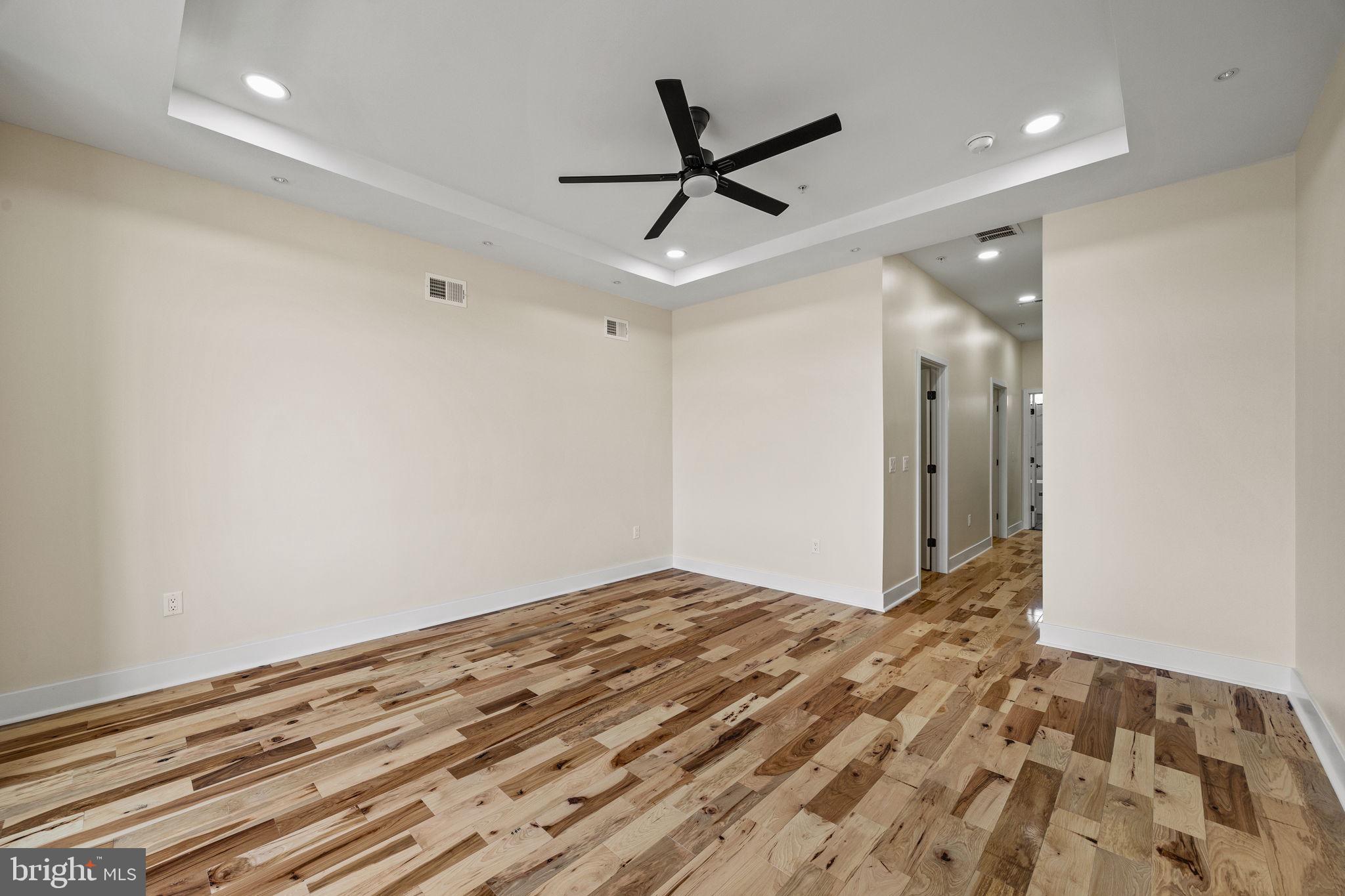 274 South Frazier Street Philadelphia, PA 19139 - Photo 20 of 34 a view of a livingroom with a ceiling fan and wooden floor