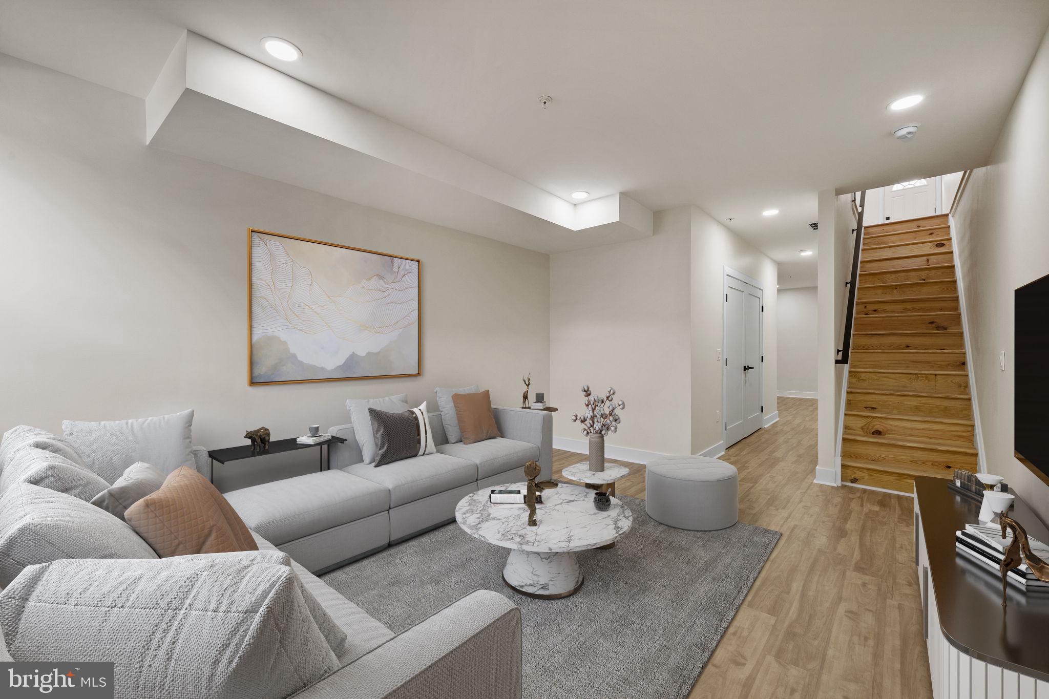 274 South Frazier Street Philadelphia, PA 19139 - Photo 27 of 34 a living room with furniture and wooden floor