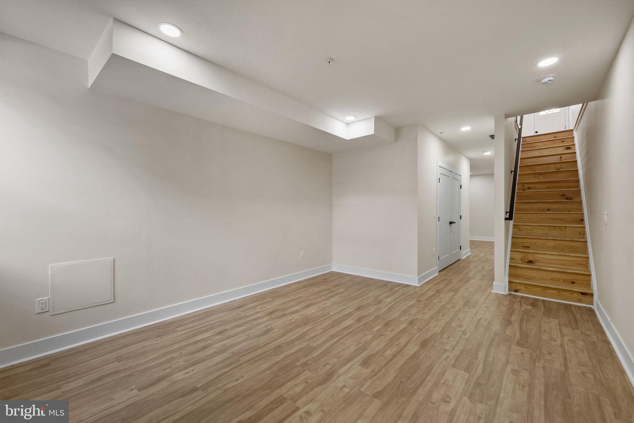 274 South Frazier Street Philadelphia, PA 19139 - Photo 28 of 34 an empty room with wooden floor and windows