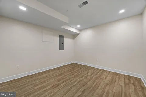 a view of room with wooden floor