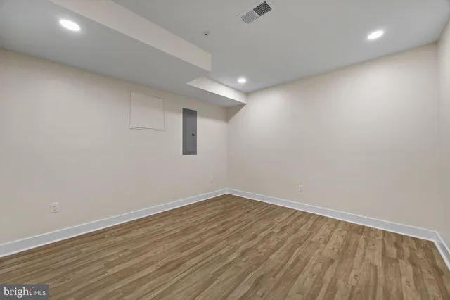 a view of room with wooden floor