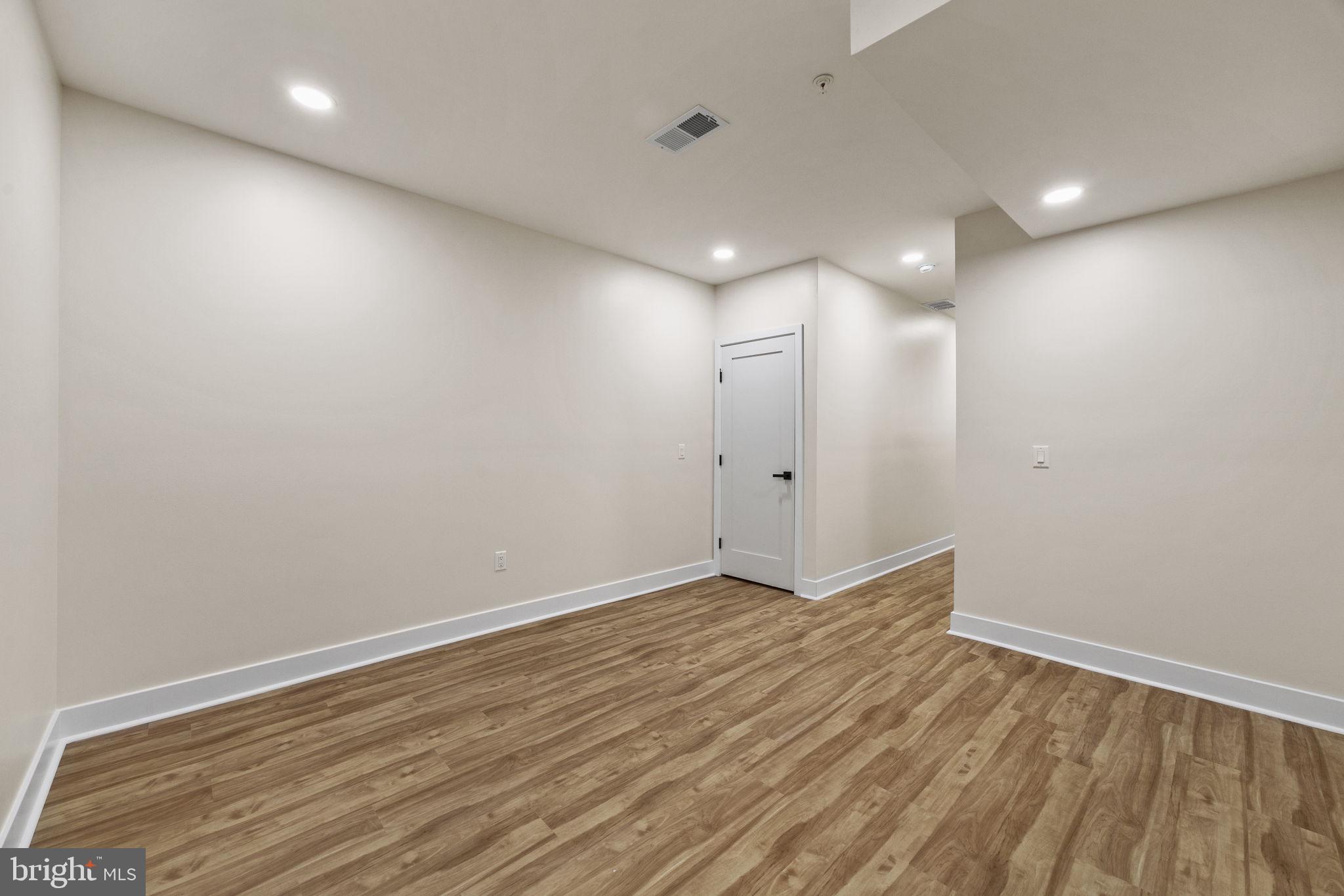 274 South Frazier Street Philadelphia, PA 19139 - Photo 31 of 34 a view of room with wooden floor