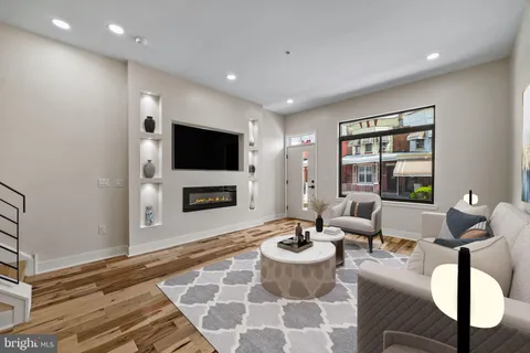 a living room with a couch and a flat screen tv