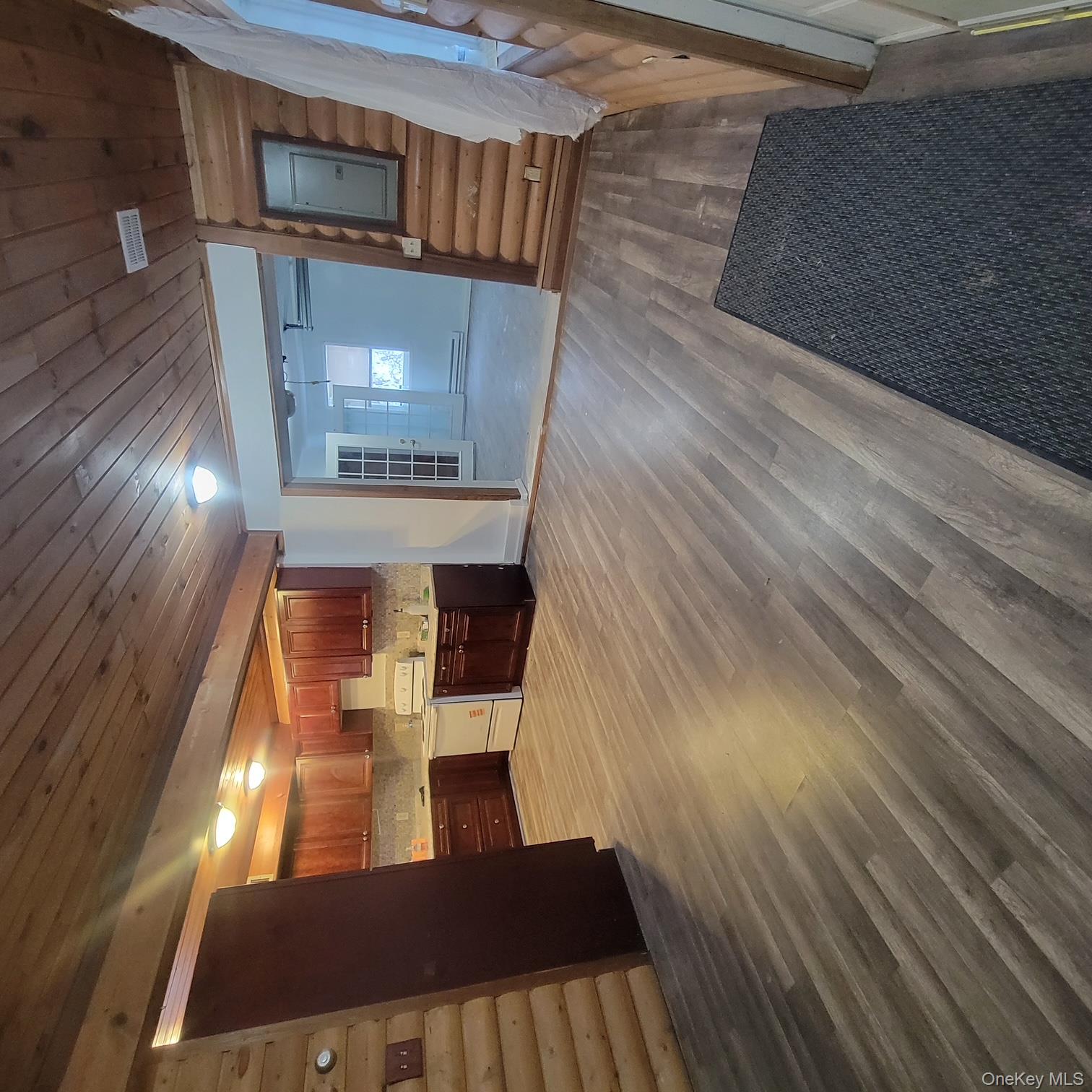 5 Elm Street Middletown, NY 10940 - Photo 3 of 7 a view of empty room with wooden floor and kitchen view